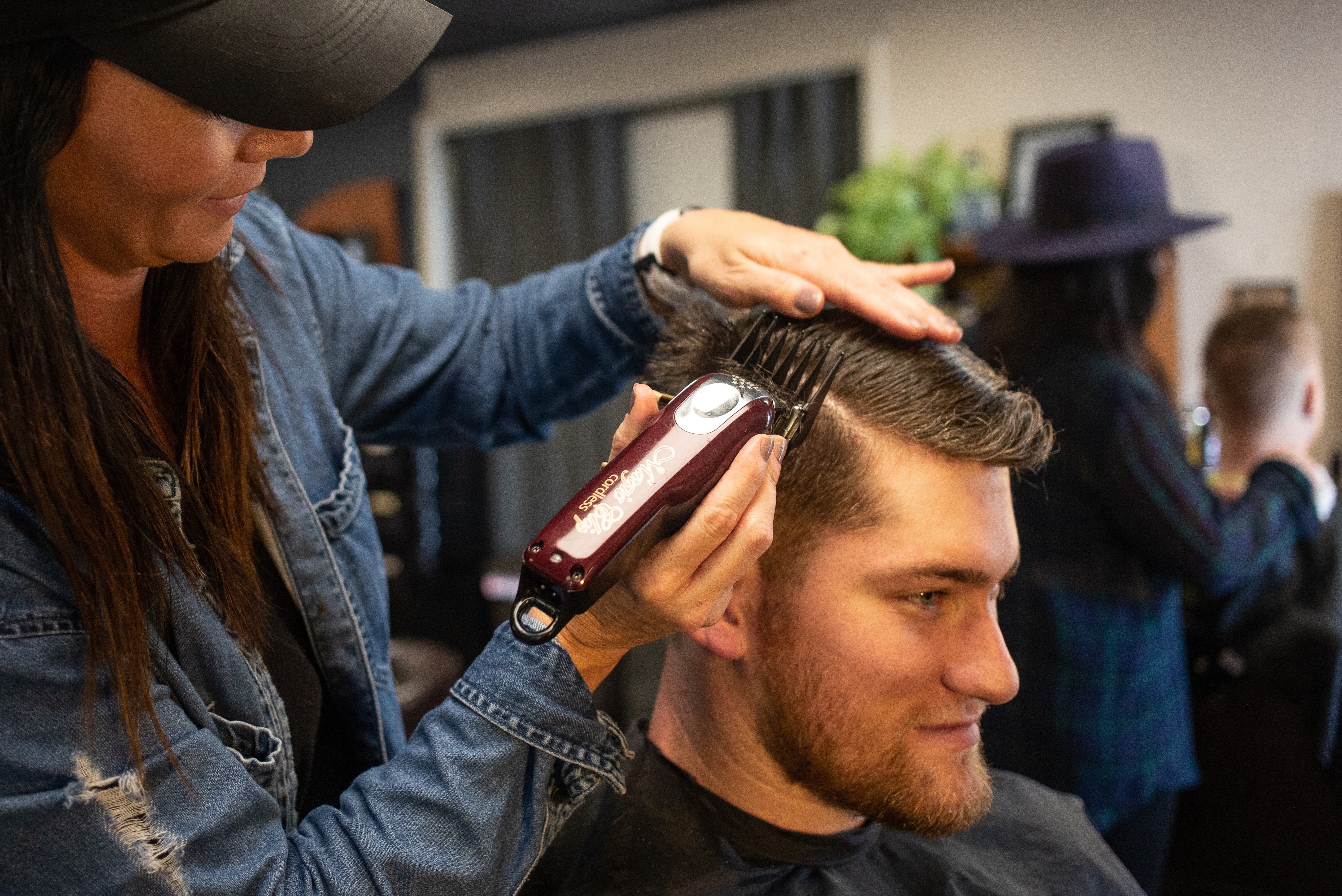 man getting haircut with smile on face