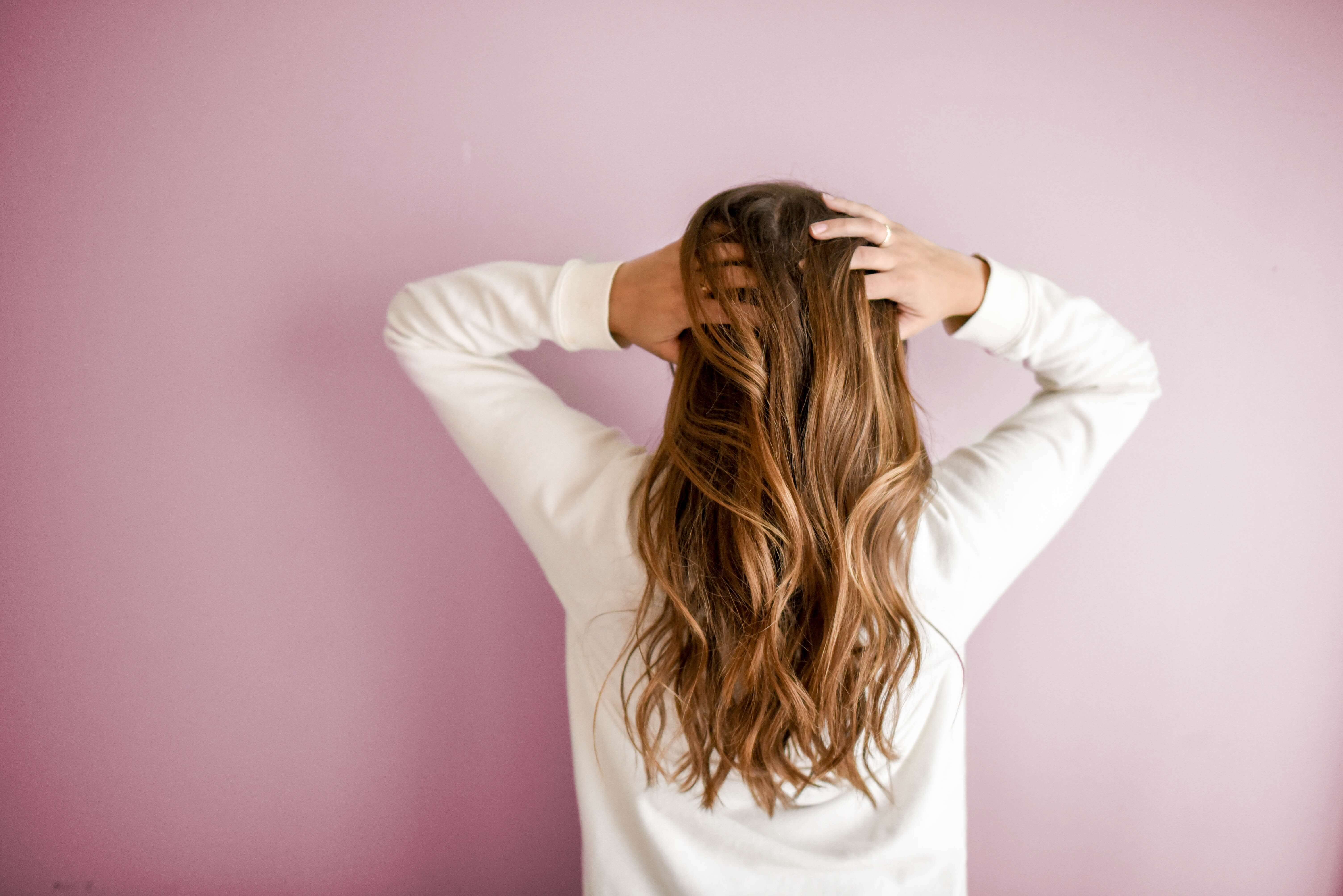 back of head girl with long curly hair